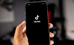 A photo of the TikTok app being opened on a mobile phone